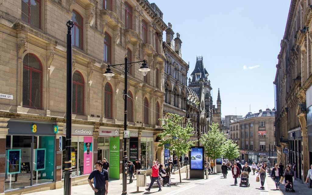 People walking on Bank Street, Bradford on a sunny day