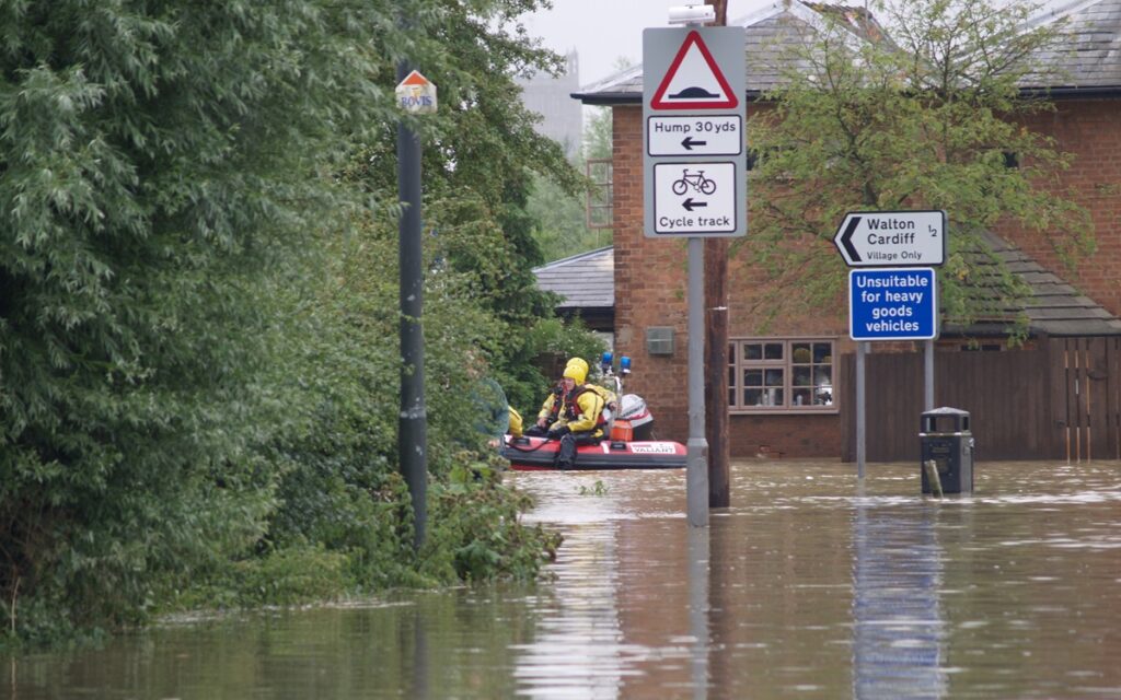 Emergency service workers on a raft following flooding in the UK