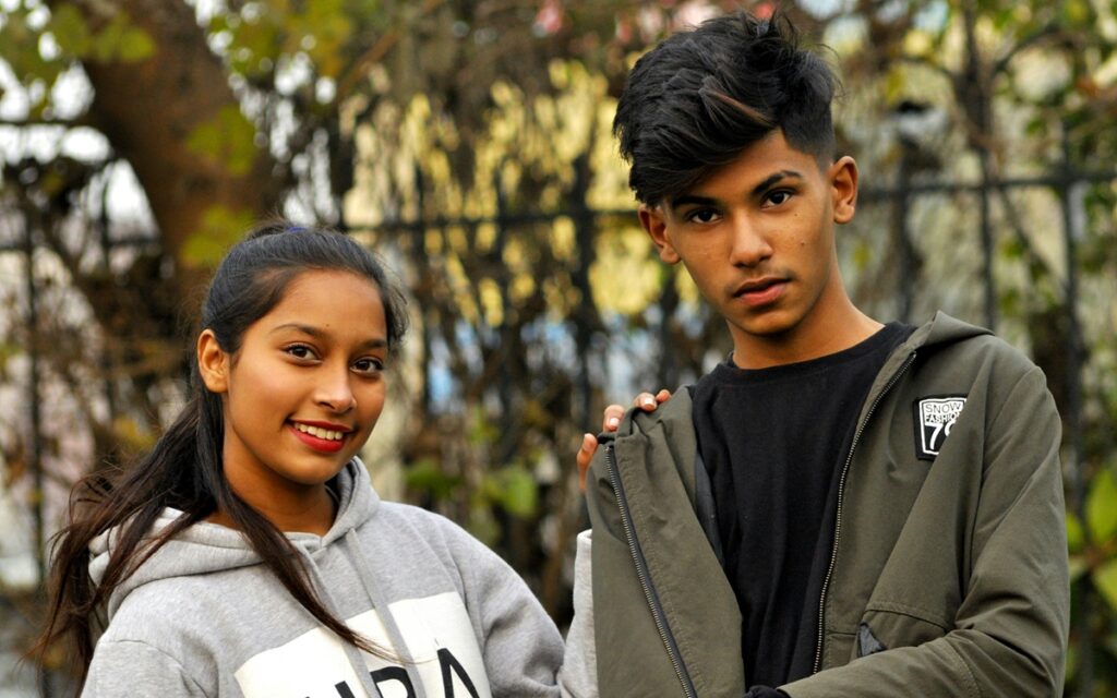 Young woman and young man stood outside