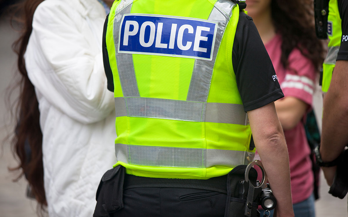 Police officer on duty engaging with members of the public
