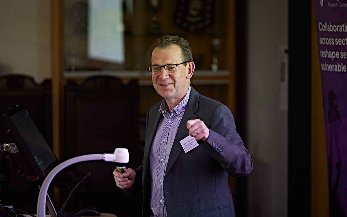 Professor Adam Crawford speaking at an event